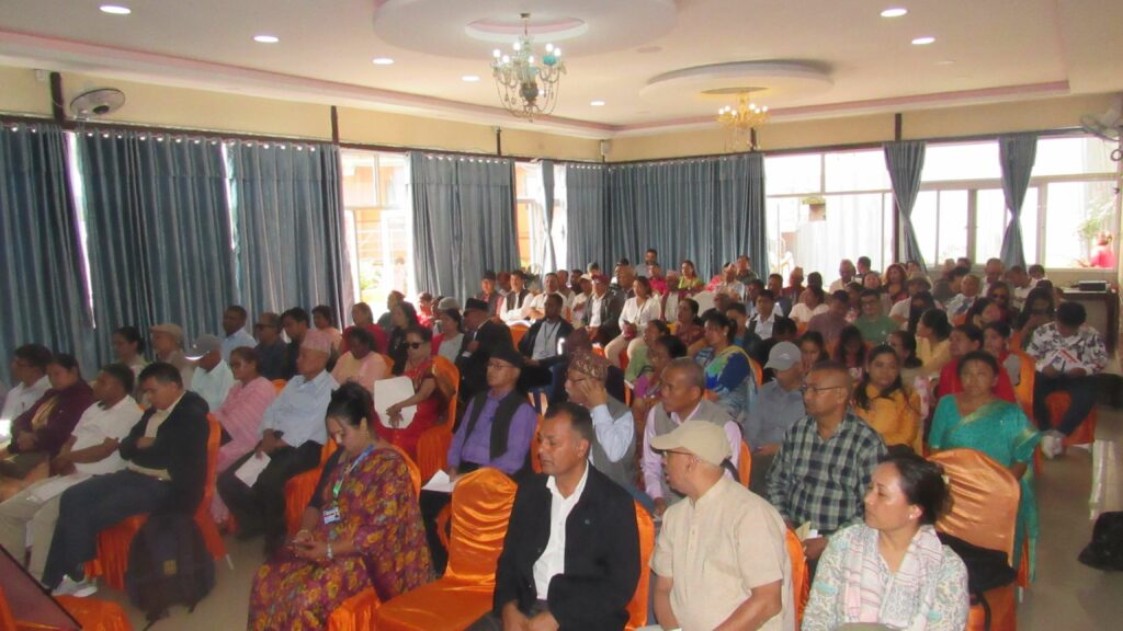 participants of AGM sitting in chair and looking at the stage